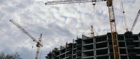 Construction,Site,With,Cranes,Against,The,Sky