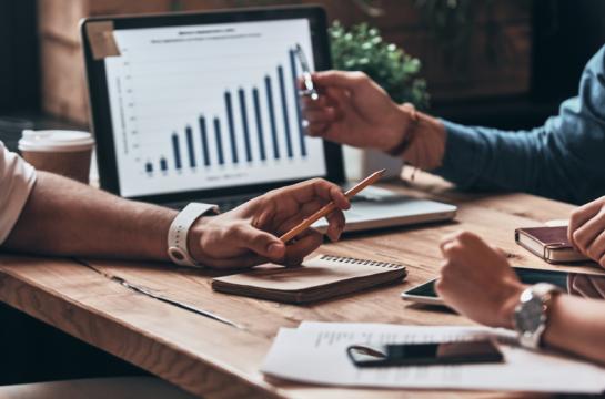 Checking,The,Numbers.,Close,Up,Of,Young,Business,People,Analyzing